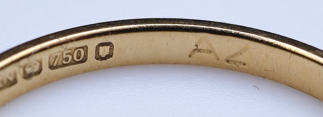 A diamond ring and two gold wedding rings
